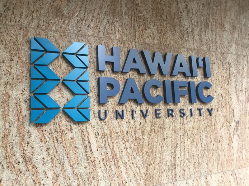 Hawaii Pacific University dimensional logo sign on a stone wall